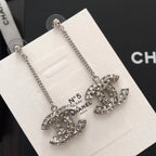 Rhinestone Chanel logo drop earrings, silver-tone chain with stud backs