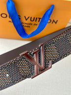 Belt close-up with textured dark strap and silver-toned LV buckle