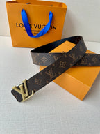 Dark monogram belt with rectangular gold buckle featuring LV-style monogram