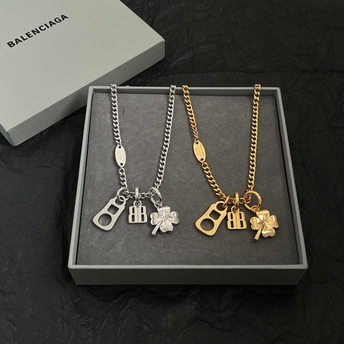 Balenciaga pendant necklace set with silver and gold chain, clover and BB charms