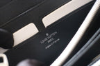 Small Louis Vuitton zip wallet interior with brand stamp and “made in France” text.
