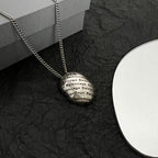 Round logo pendant necklace with layered silver-tone chain