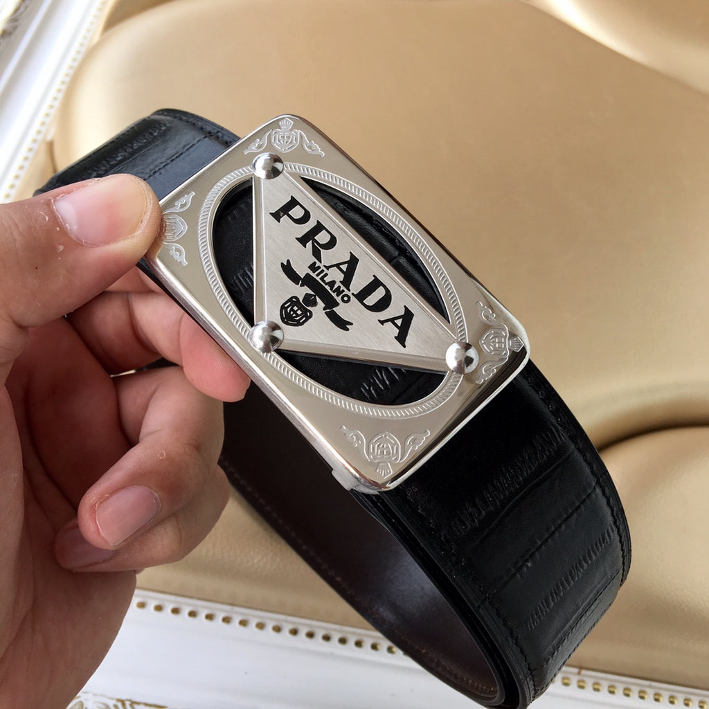 Prada belt with dark leather strap and silver buckle plate, side view