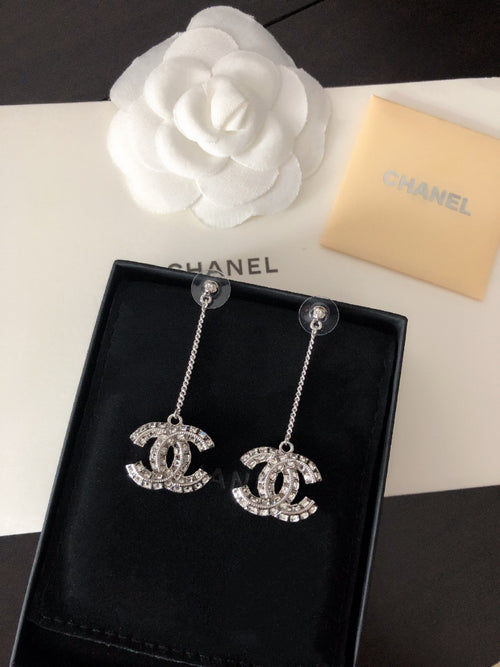 Rhinestone Chanel logo drop earrings with silver-tone chain and stud tops