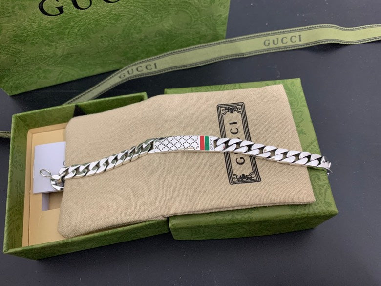 Silver chain bracelet with white leather strap, Gucci web stripe detail, lobster clasp