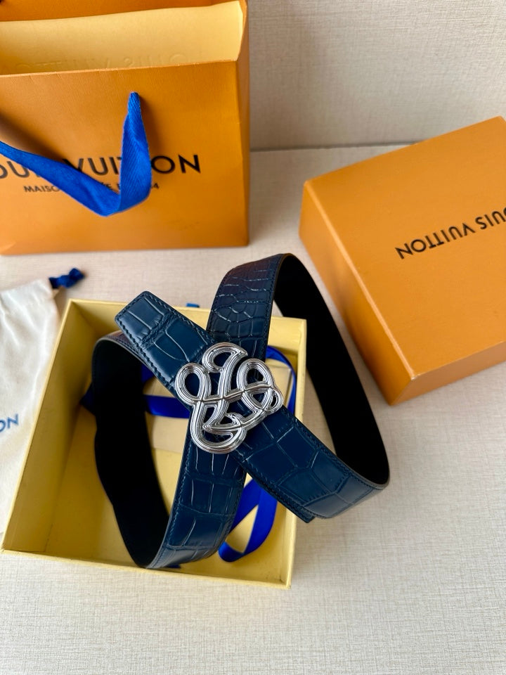 Louis Vuitton belt and buckle: dark blue embossed leather with silver-tone knot