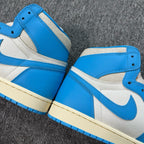 High-top sneakers with blue toe, white uppers, blue swoosh, padded collar