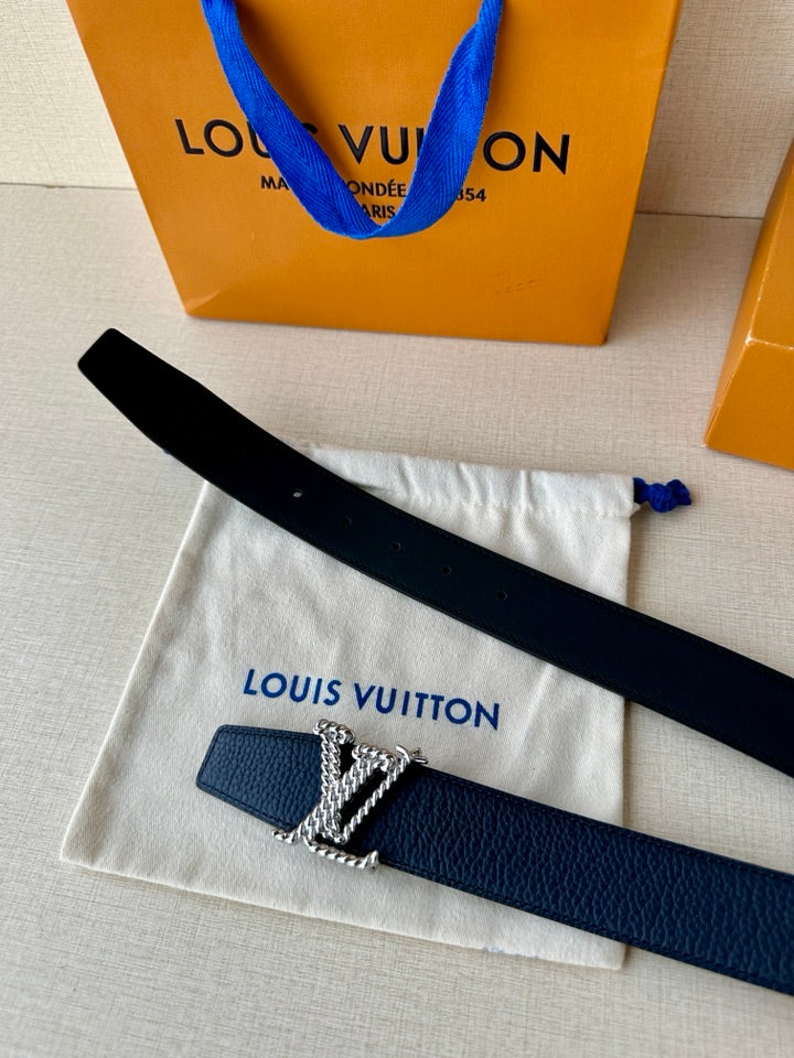 Louis Vuitton leather belt dark blue with gold-tone LV buckle; underside shows strap length