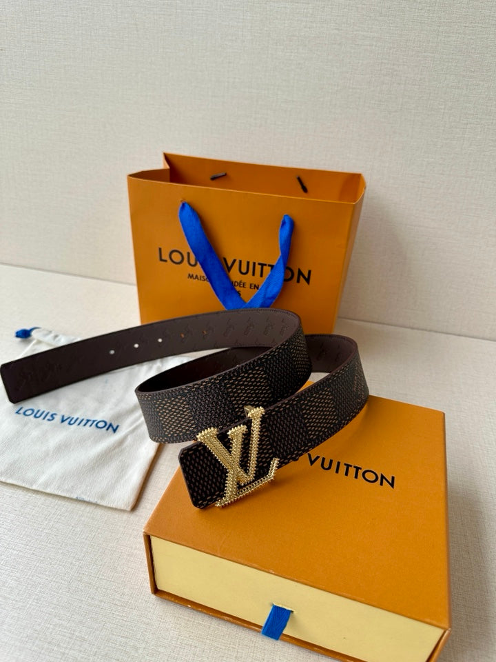 Dark monogram belt with gold LV-style rhinestone buckle and smooth leather back.