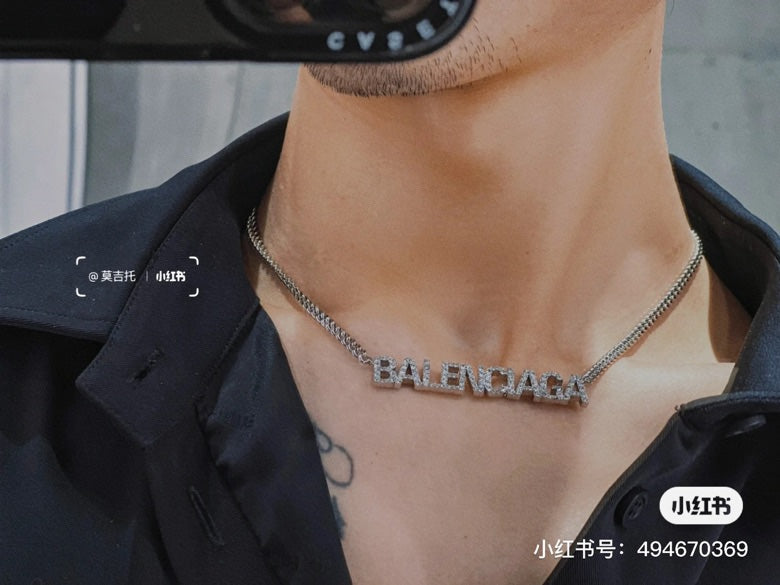 Silver Balenciaga logo pendant necklace on neckline