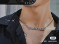 Silver Balenciaga logo pendant necklace on neckline
