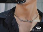 Silver Balenciaga logo pendant necklace on neckline