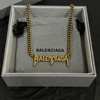 Gold Balenciaga logo necklace in gift box with twisted chain and logo charms