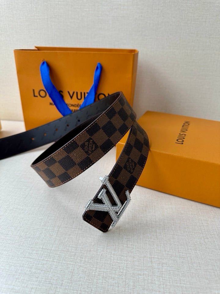 Louis Vuitton Damier check belt with silver V buckle and dark brown leather edge