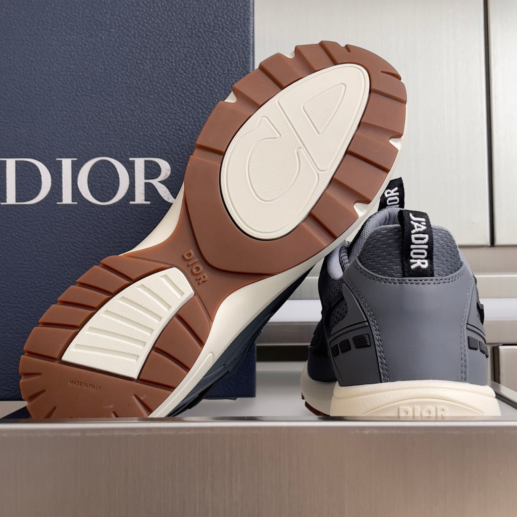 Unisex Dior sneakers with brown outsole tread and off-white sole caps.