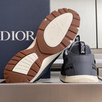 Unisex Dior sneakers with brown outsole tread and off-white sole caps.
