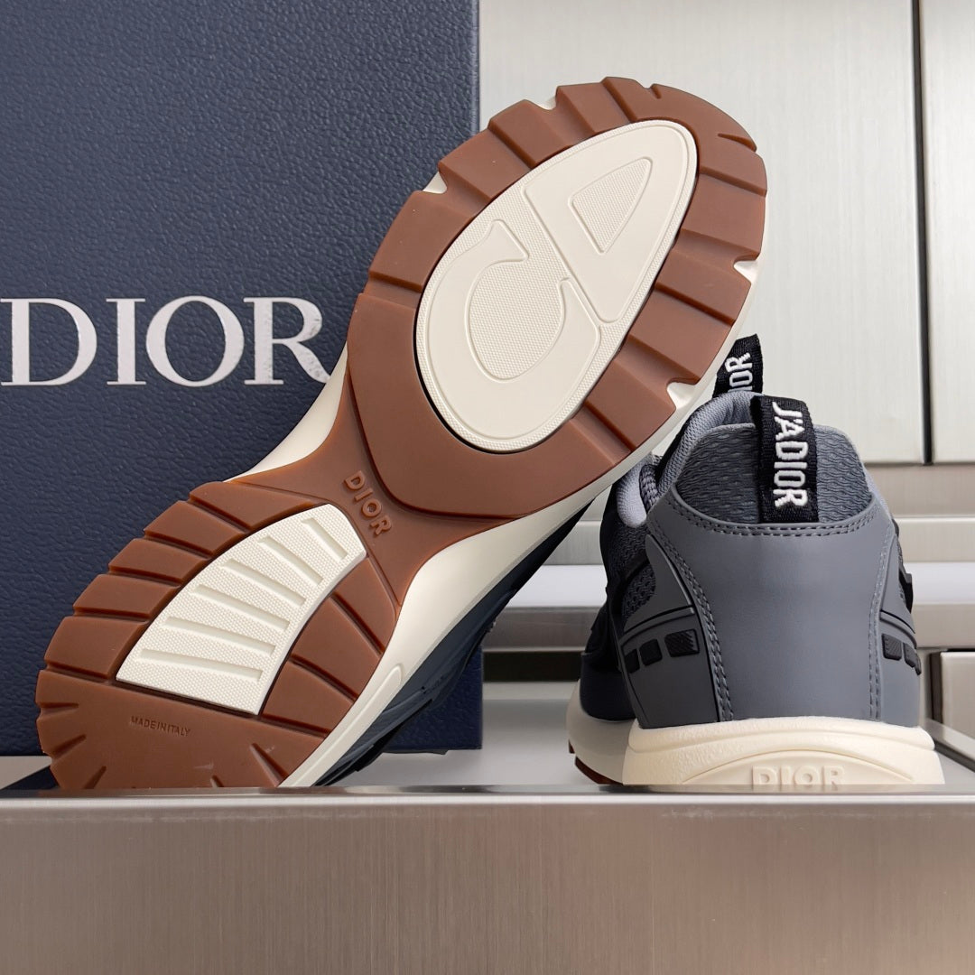 Unisex Dior sneakers with brown outsole tread and off-white sole caps.