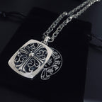 Silver square pendant necklace with filigree scroll design on linked chain