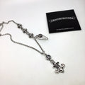 Silver chain necklace with fleur-de-lis and lock charms, with silver polishing cloth