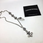 Silver chain necklace with fleur-de-lis and lock charms, with silver polishing cloth