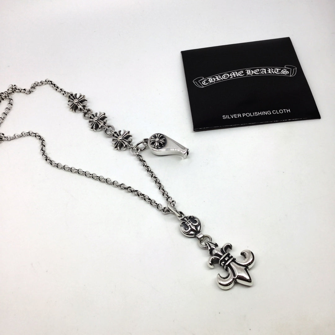 Silver chain necklace with fleur-de-lis and lock charms, with silver polishing cloth