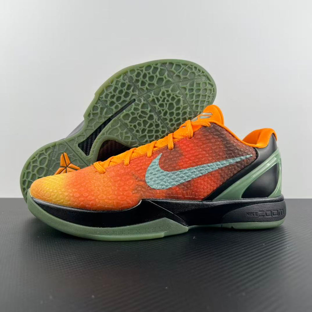 Basketball shoe outsole with textured green pattern and orange upper