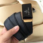Prada belt rolled up in dark textured leather with gold-tone logo buckle