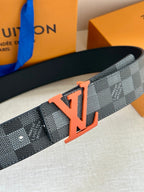 Louis Vuitton belt with LV logo buckle on dark checkered strap, close-up detail