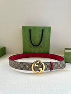 Gucci GG canvas belt with gold-tone G buckle and red leather backing