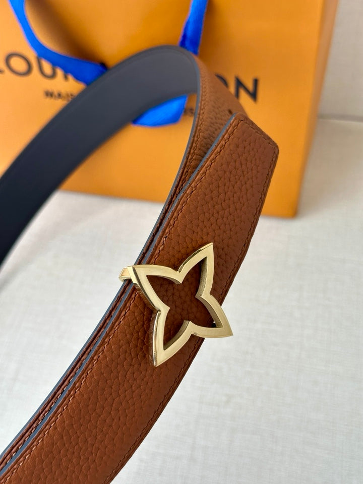 Louis Vuitton brown leather belt close-up of star buckle and keeper