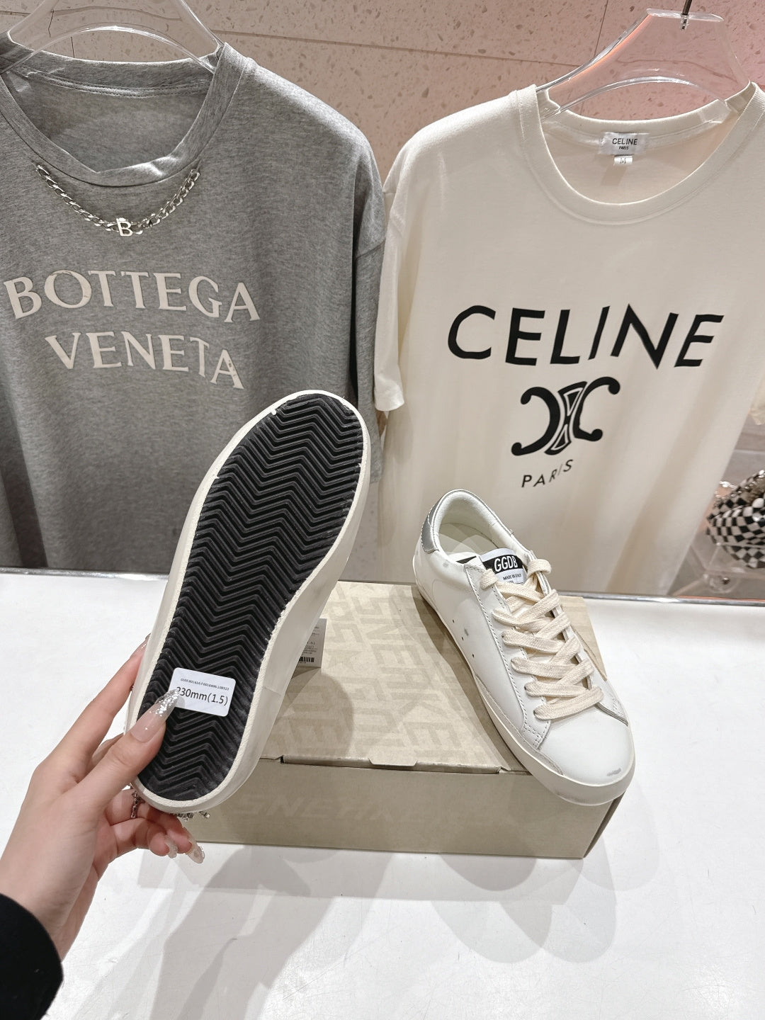 Golden Goose sneakers with textured dark rubber sole, side view