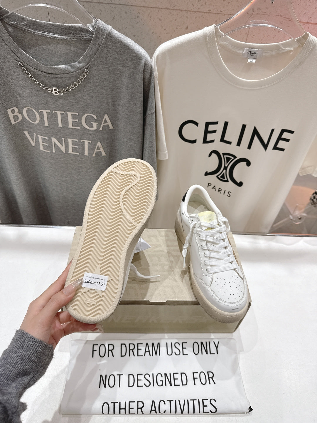 White lace-up sneakers with textured outsole, side view