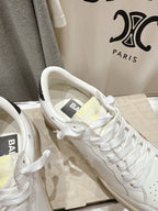 Close-up of white sneaker uppers with laces and interior lining detail