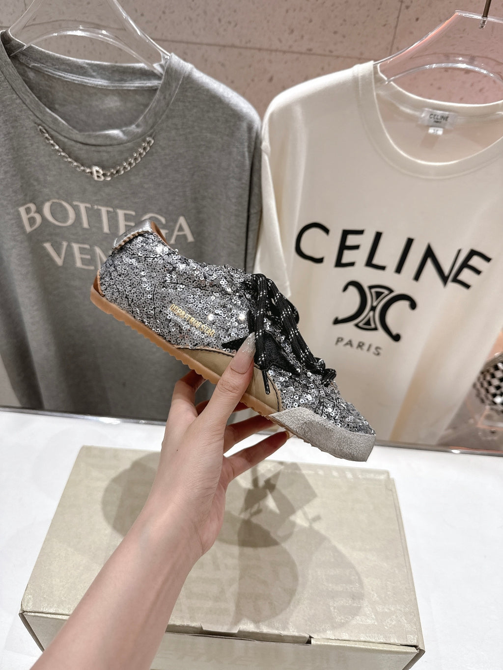 Held silver and black sequin sneaker with black lace, side profile