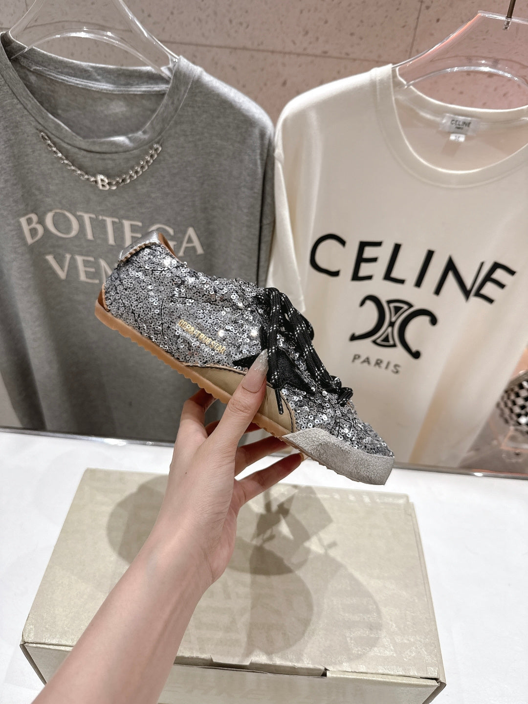 Held silver and black sequin sneaker with black lace, side profile