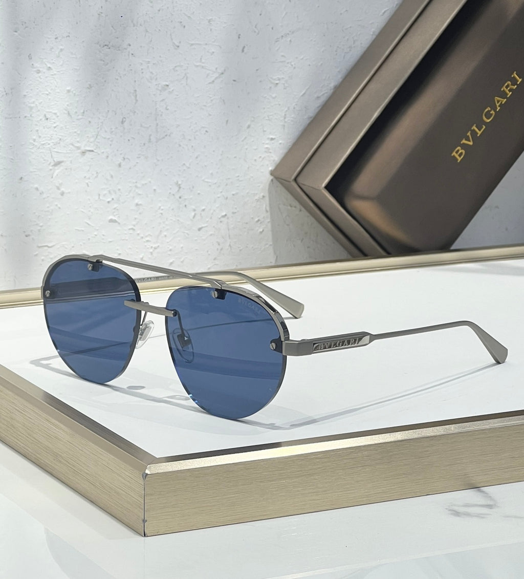 Bvlgari sunglasses with blue-tinted lenses, silver frame, and straight metal arms