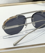 Bvlgari sunglasses close-up with dark lenses, gold trim, and Bvlgari logo
