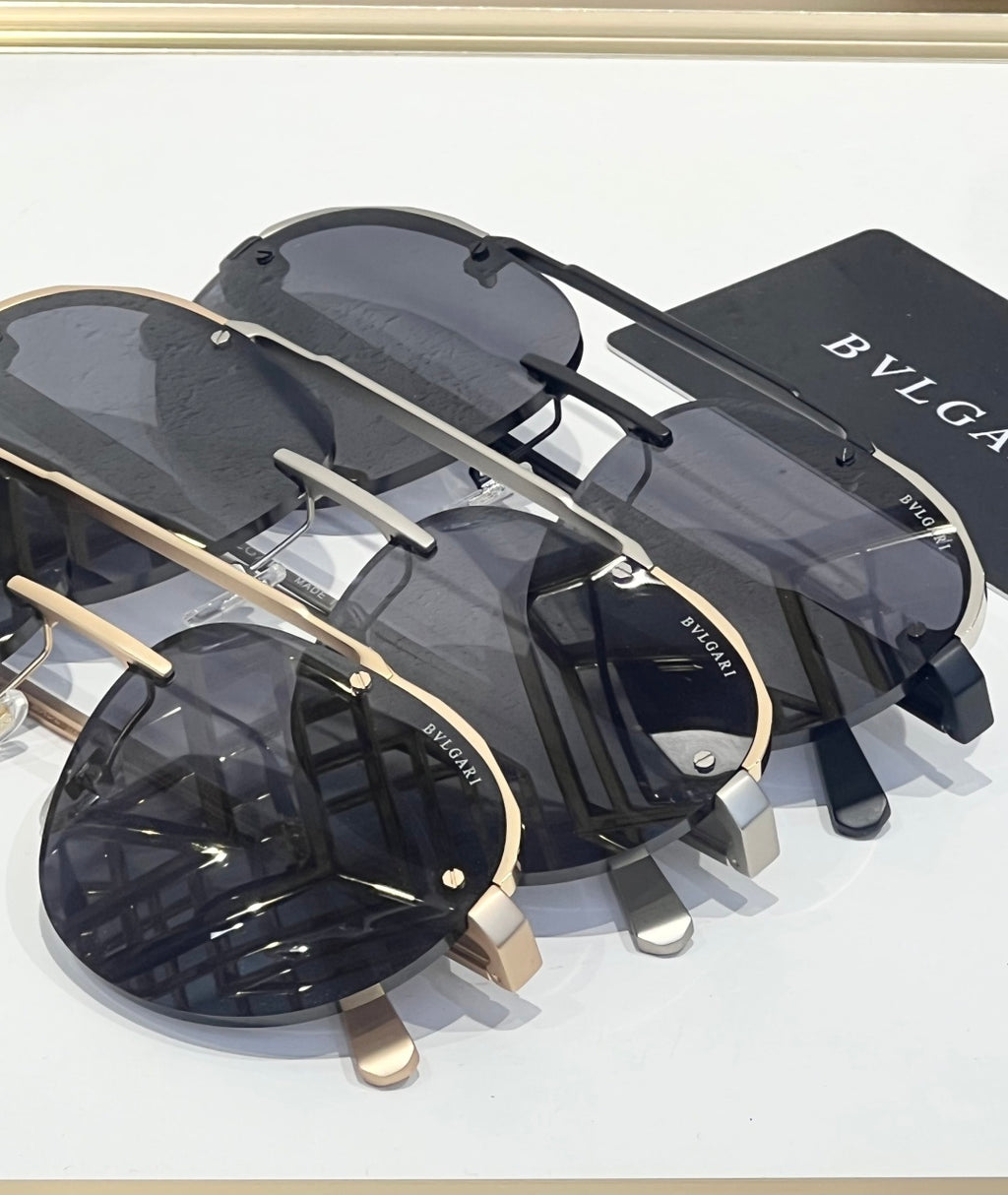 Bvlgari sunglasses set with dark lenses and gold-toned metal arms
