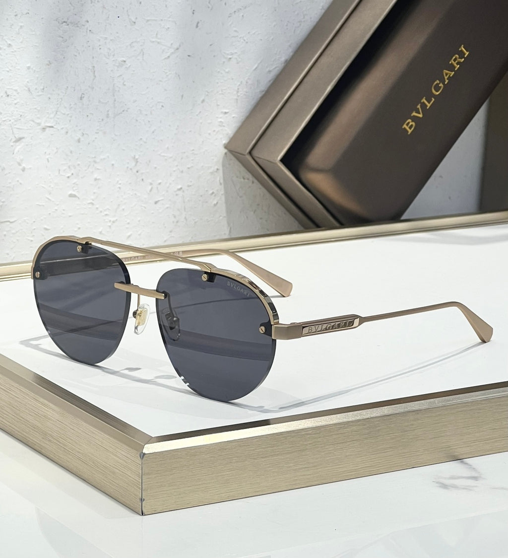 Bvlgari sunglasses with dark lenses, gold-toned frame, and straight metal arms