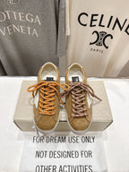 Golden Goose low-top sneakers in tan with white star patch and orange laces