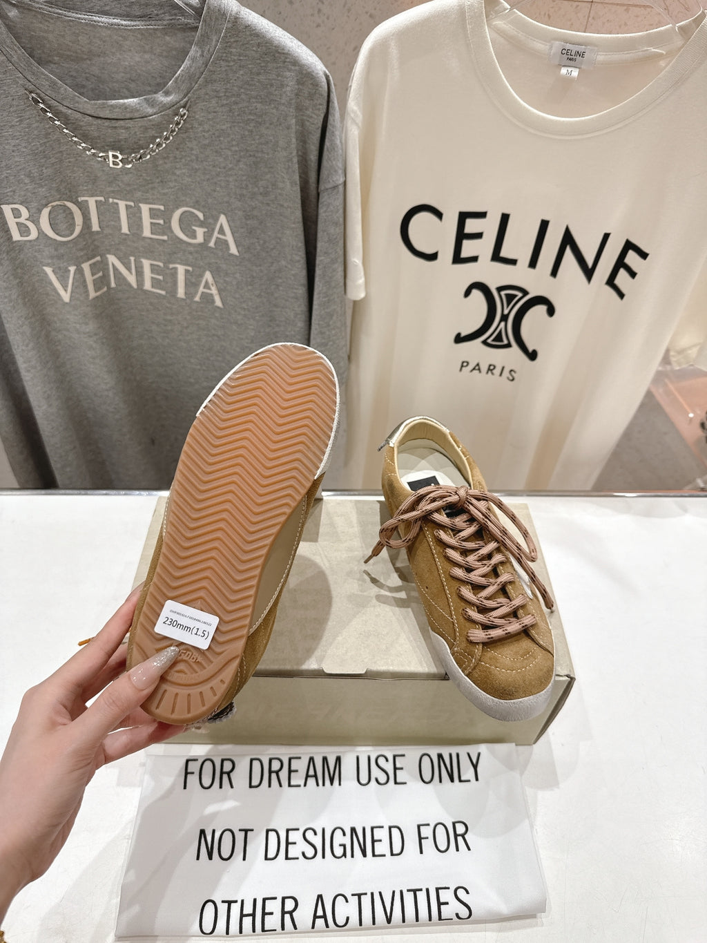 Golden Goose tan sneakers with textured rubber sole and brown laces, white star patch