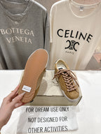 Golden Goose tan sneakers with textured rubber sole and brown laces, white star patch