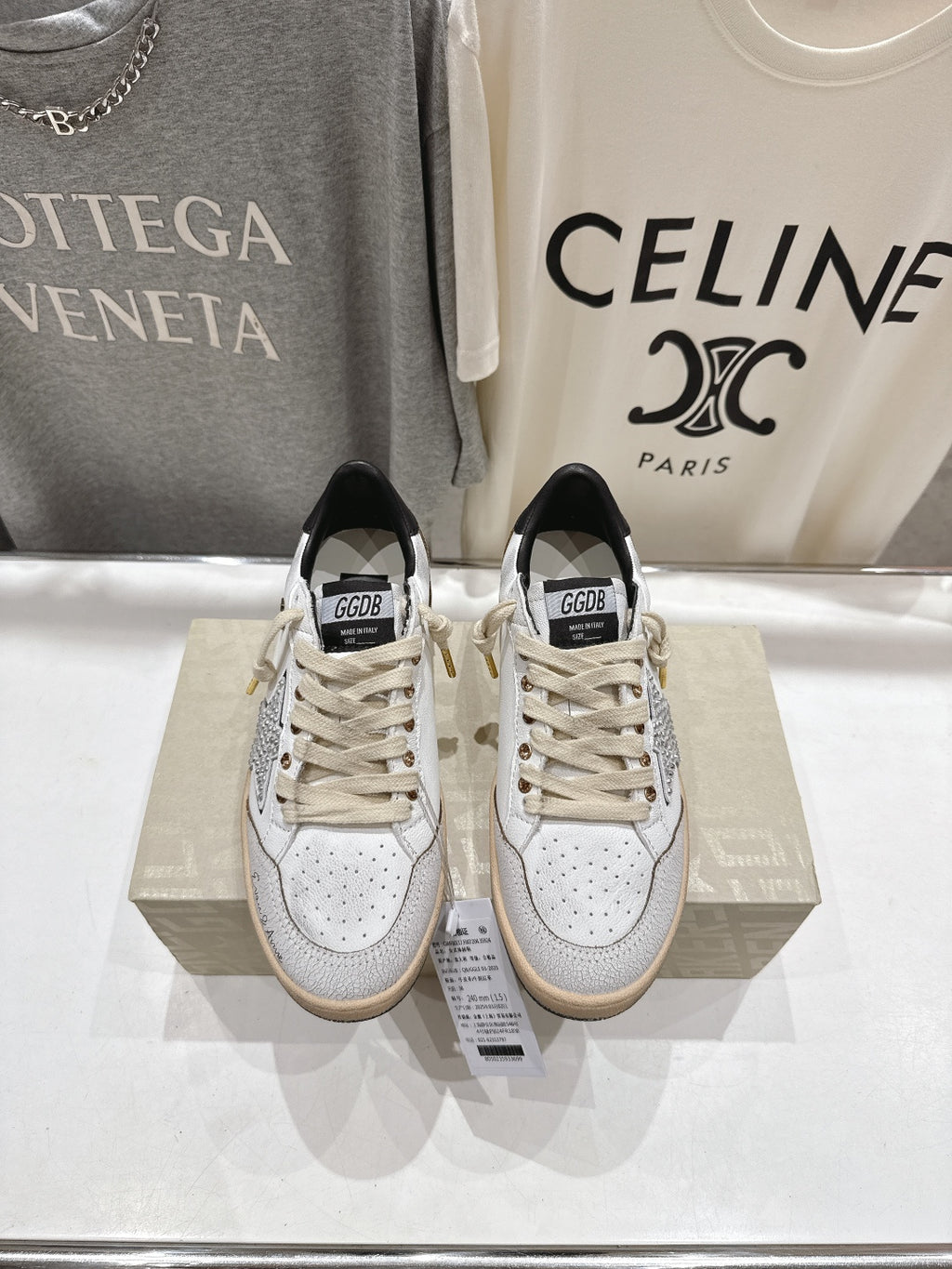 Golden Goose sneakers with white leather uppers, lace-up front, black tongue label