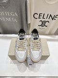 Golden Goose sneakers with white leather uppers, lace-up front, black tongue label