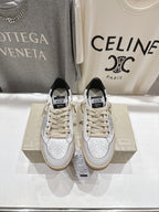 Golden Goose sneakers with white leather uppers, lace-up front, black tongue label