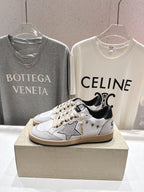 Golden Goose low-top sneakers, white leather with metallic star patch and black trim