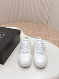 White Prada unisex lace-up sneakers with PRADA logo on tongue