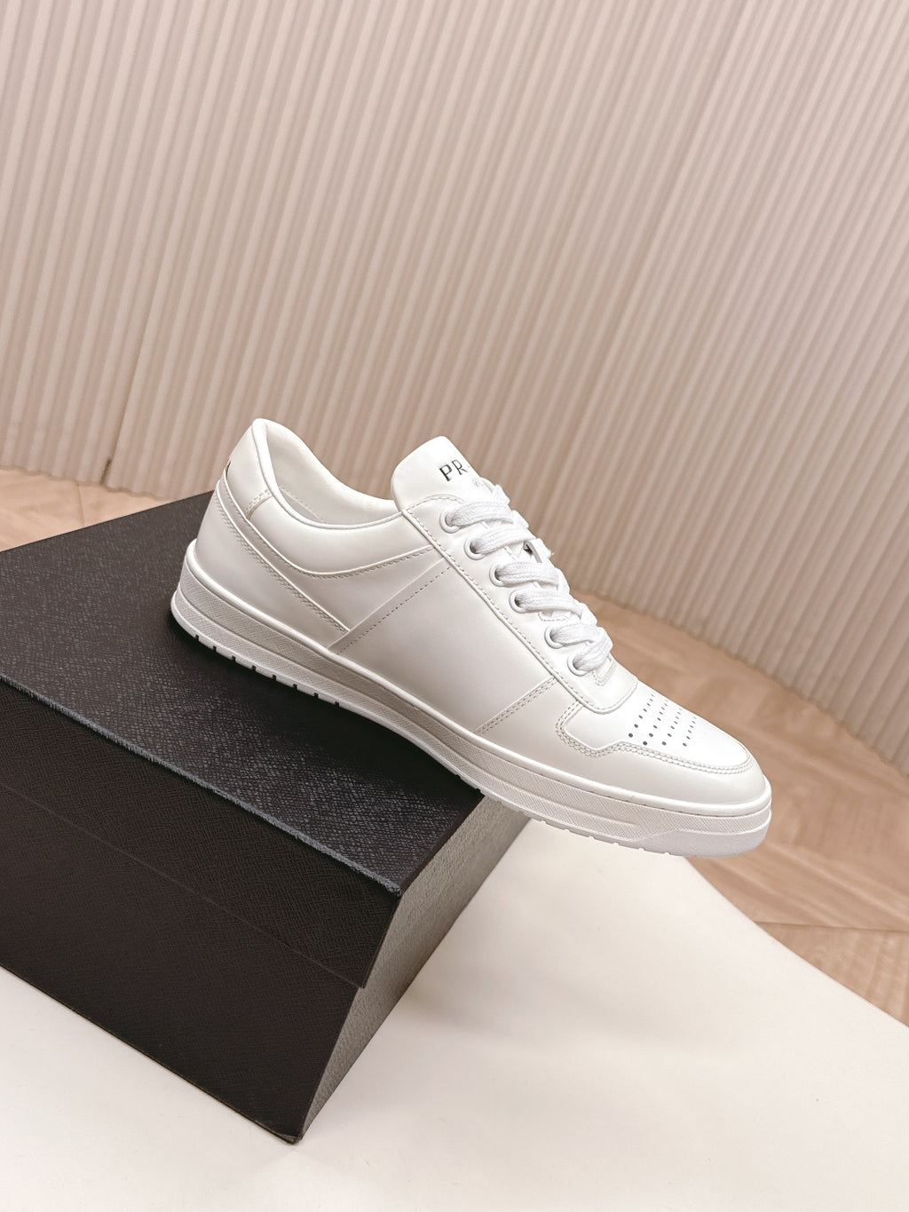 White Prada unisex low-top sneakers, side profile view