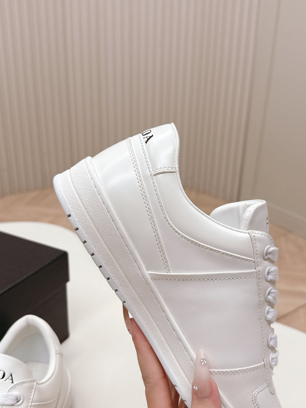 White Prada unisex sneakers close-up of side panel and thick sole