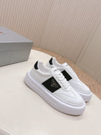 Prada unisex sneakers in white with black side stripe and white lace-up